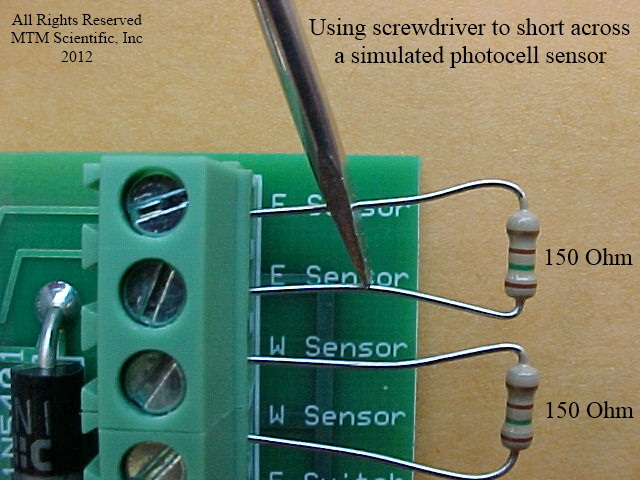 Shorting across a resistor using a screwdriver